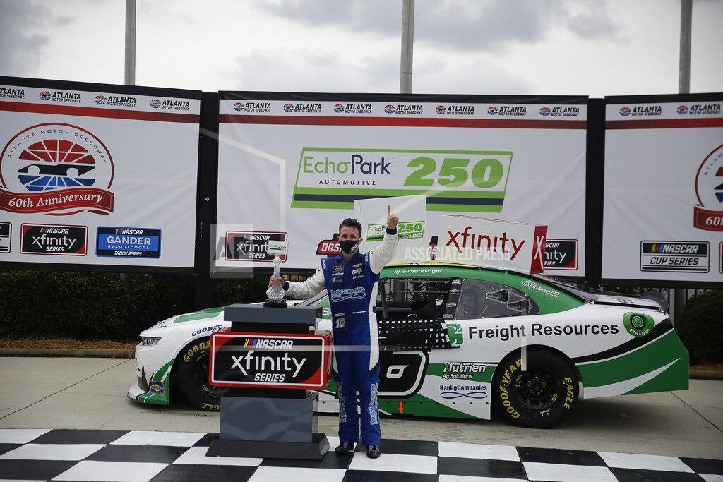 Brynn Anderson AJ Allmendinger celebrates after he won a NASCAR Xfinity Series auto race at Atlanta Motor Speedway, Saturday, June 6, 2020, in Hampton, Ga. (AP Photo/Brynn Anderson)