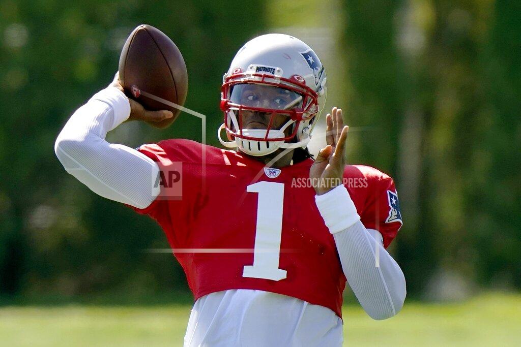 New England Patriots quarterback Cam Newton tosses the ball during an NFL football training camp practice, Tuesday, Aug. 18, 2020, in Foxborough, Mass. (AP Photo/Steven Senne, Pool)