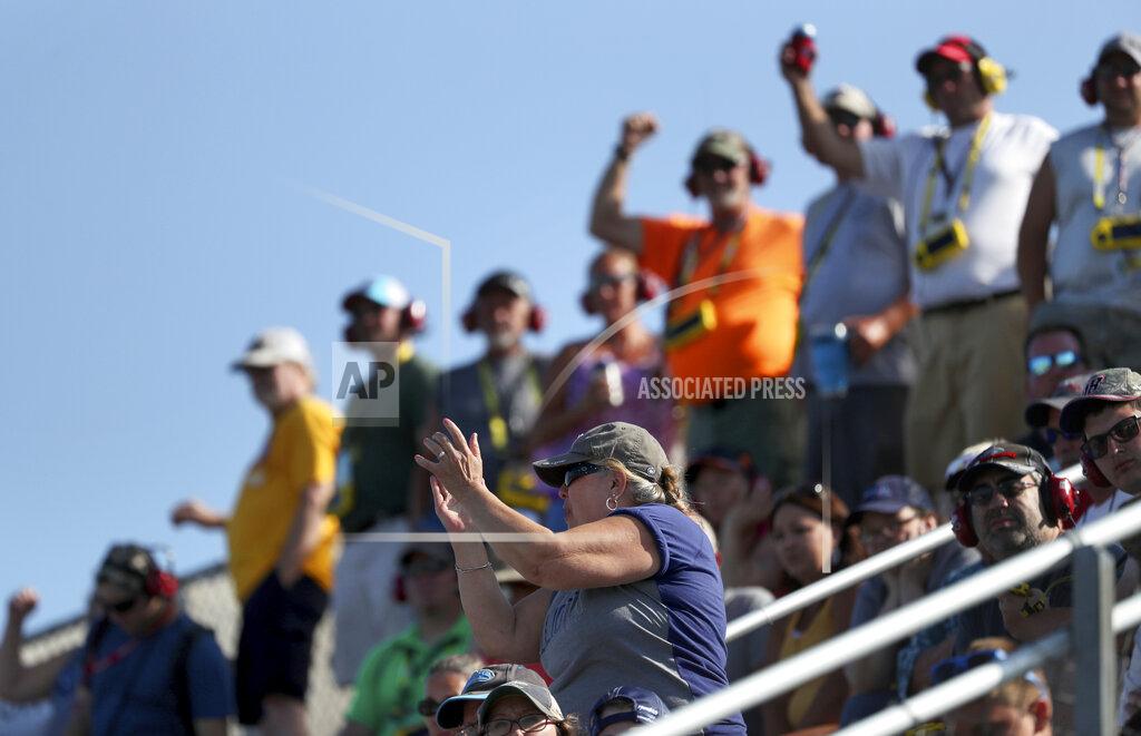 John Munson Fans watch the action during a NASCAR Cup Series auto race at Watkins Glen International, Sunday, Aug. 4, 2019, in Watkins Glen, N.Y. (AP Photo/John Munson)