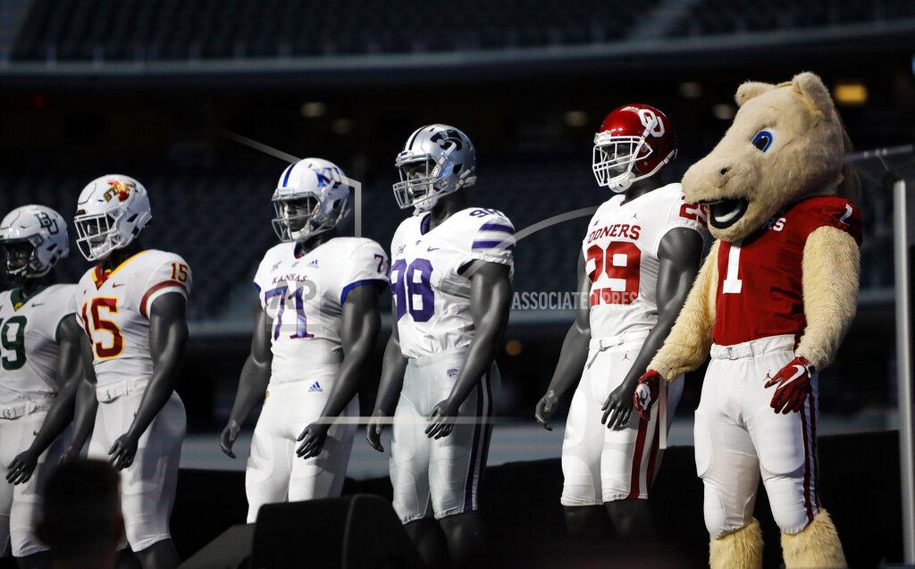 David Kent Oklahoma mascot Boomer poses to match the team uniforms on stage on the first day of Big 12 Conference NCAA college football media days Monday, July 15, 2019, at AT&T Stadium in Arlington, Texas. (AP Photo/David Kent)