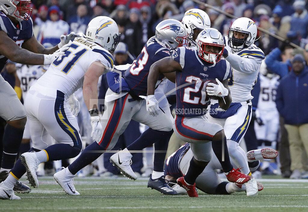 Elise Amendola New England Patriots running back Sony Michel (26) runs from Los Angeles Chargers outside linebacker Kyle Emanuel (51) during the second half of an NFL divisional playoff football game, Sunday, Jan. 13, 2019, in Foxborough, Mass. (AP Photo/Elise Amendola)