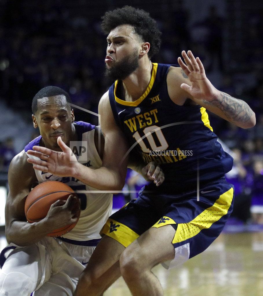 Orlin Wagner Kansas State guard Barry Brown Jr., left, drives the lane against West Virginia guard Jermaine Haley (10) during the second half of an NCAA college basketball game in Manhattan, Kan., Wednesday, Jan. 9, 2019. (AP Photo/Orlin Wagner)