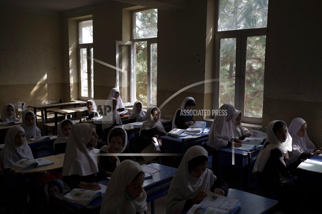 Felipe Dana Girls prepare for class at a school in Kabul, Afghanistan, Sunday, Sept. 12, 2021. (AP Photo/Felipe Dana)
