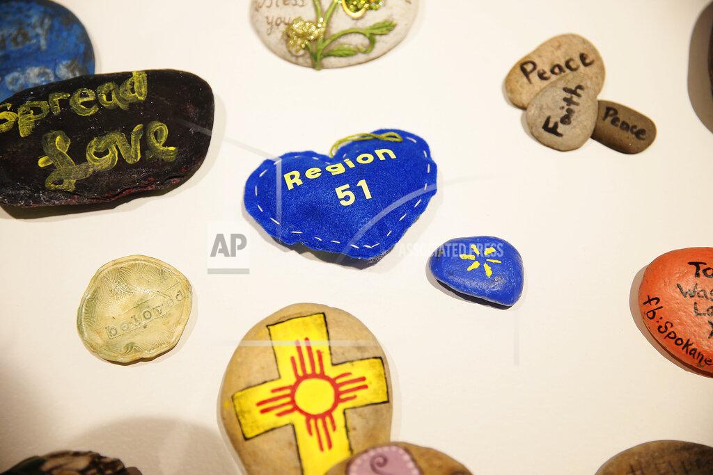Briana Sanchez Curator Erica Marin works on "Resilience" the art exhibit Friday, July 24, at the El Paso Museum of History in El Paso. (Briana Sanchez/The El Paso Times via AP)