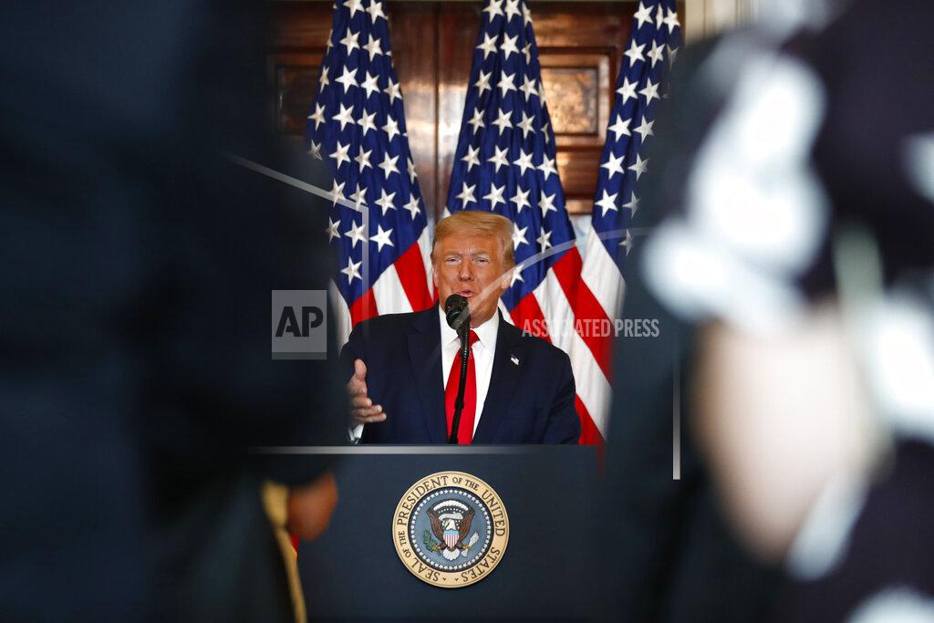 President Donald Trump speaks during an event to present the Presidential Medal of Freedom to Jim Ryun, in the Blue Room of the White House, Friday, July 24, 2020, in Washington. (AP Photo/Alex Brandon)