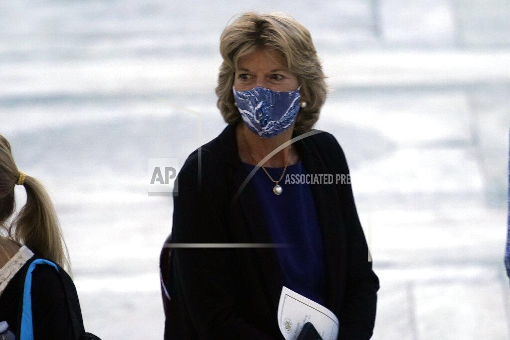 Sen. Lisa Murkowski, R-Alaska, pays respects as Justice Ruth Bader Ginsburg lies in repose under the Portico at the top of the front steps of the U.S. Supreme Court building on Wednesday, Sept. 23, 2020, in Washington. Ginsburg, 87, died of cancer on Sept. 18. (AP Photo/Andrew Harnik, Pool)