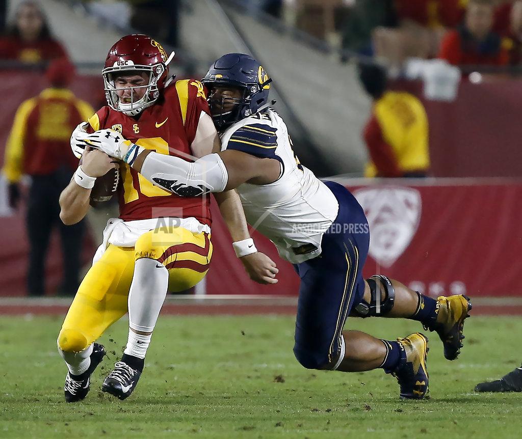 Alex Gallardo Southern California quarterback JT Daniels, left, is sacked by California defensive end Luc Bequette during the first half of an NCAA college football game in Los Angeles, Saturday, Nov. 10, 2018. (AP Photo/Alex Gallardo)