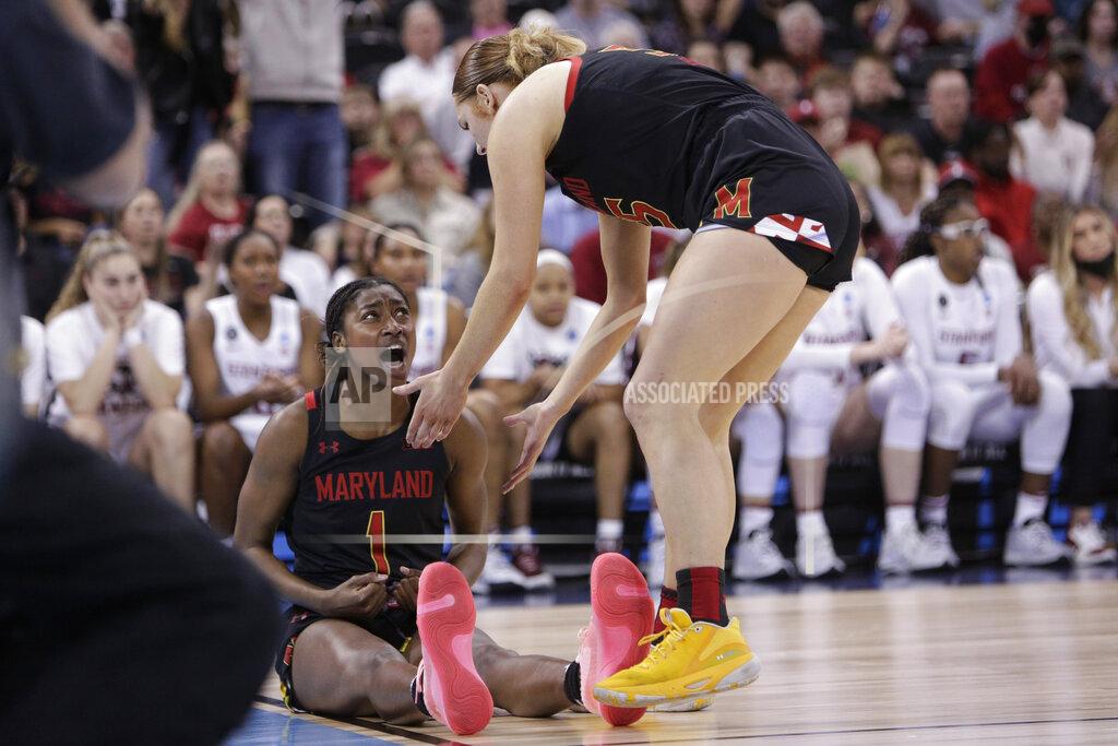 Young Kwak Maryland guard Diamond Miller (1) reacts as she is helped up by forward Chloe Bibby, right, during the second half of a college basketball game against Stanford in the Sweet 16 round of the NCAA tournament, Friday, March 25, 2022, in Spokane, Wash. (AP Photo/Young Kwak)