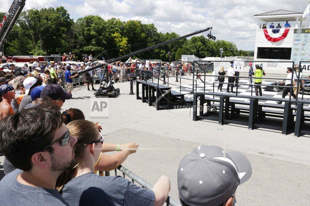 Gary C. Klein Social distancing is observed following the REV Group Grand Prix auto race Sunday, July 12, 2020, at Road America in Elkhart Lake, Wis. (Gary C. Klein/The Sheboygan Press via AP)