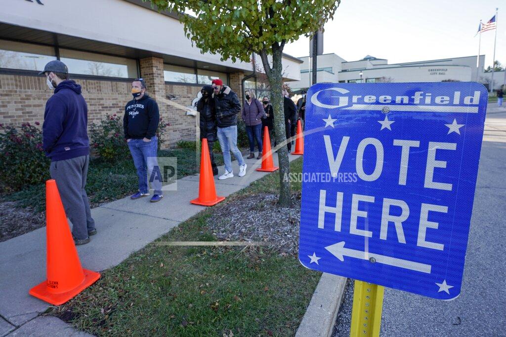 Morry Gash People line up to vote outside the Greenfield Community Center on Election Day, Tuesday, Nov. 3, 2020, in Greenfield, Wis. (AP Photo/Morry Gash)