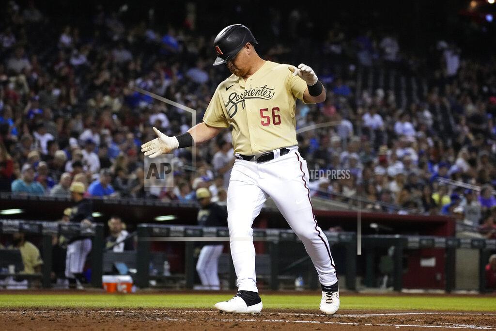 Rick Scuteri Arizona Diamondbacks' Kole Calhoun reacts after hitting a solo home run against the Los Angeles Dodgers in the second inning during a baseball game, Friday, Sept. 24, 2021, in Phoenix. (AP Photo/Rick Scuteri)