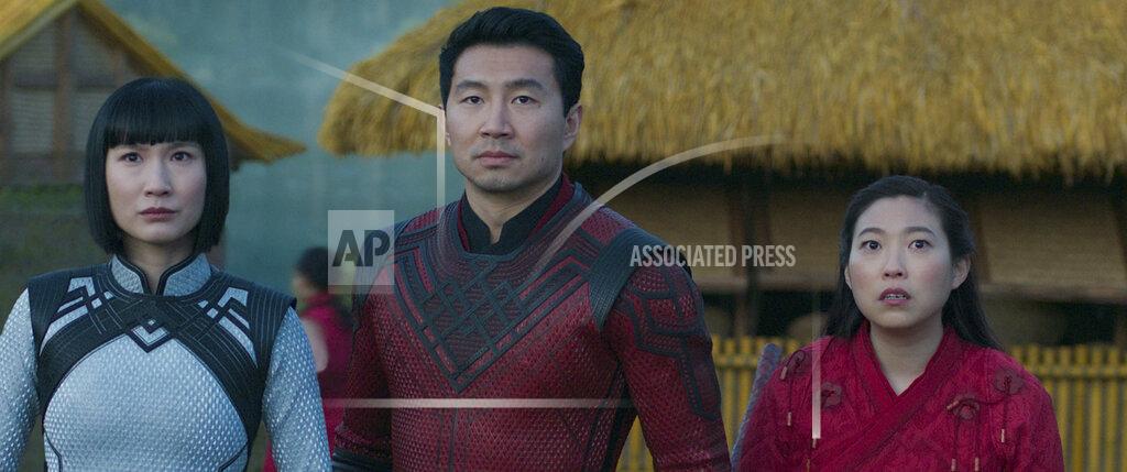 Uncredited This image released by Marvel Studios shows Meng'er Zhang, Simu Liu and Awkwafina in a scene from "Shang-Chi and the Legend of the Ten Rings." (Marvel Studios via AP)