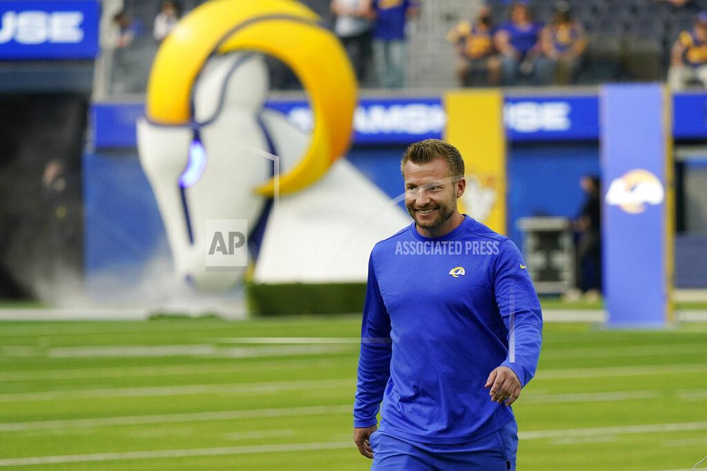 Marcio Jose Sanchez Los Angeles Rams head coach Sean McVay smiles as he walks on the field during NFL football camp Thursday, June 10, 2021, in Inglewood, Calif. (AP Photo/Marcio Jose Sanchez)