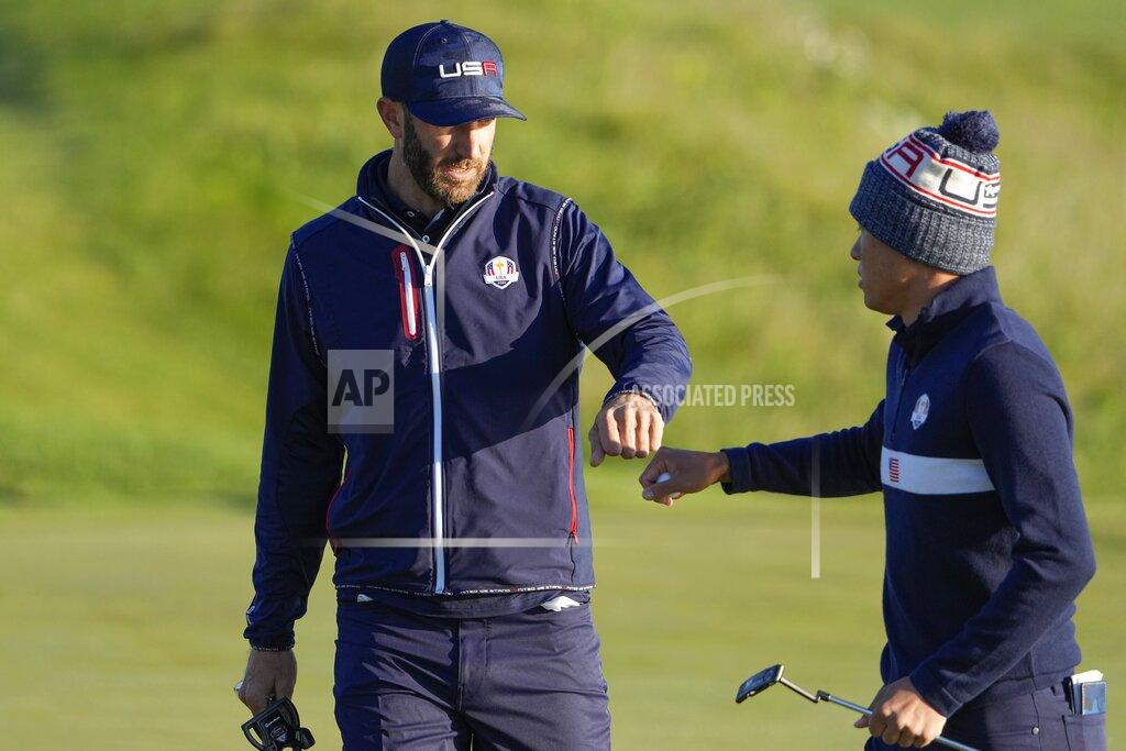 Jeff Roberson Team USA's Dustin Johnson and Team USA's Collin Morikawa react on the second hole during a foursomes match the Ryder Cup at the Whistling Straits Golf Course Saturday, Sept. 25, 2021, in Sheboygan, Wis. (AP Photo/Jeff Roberson)