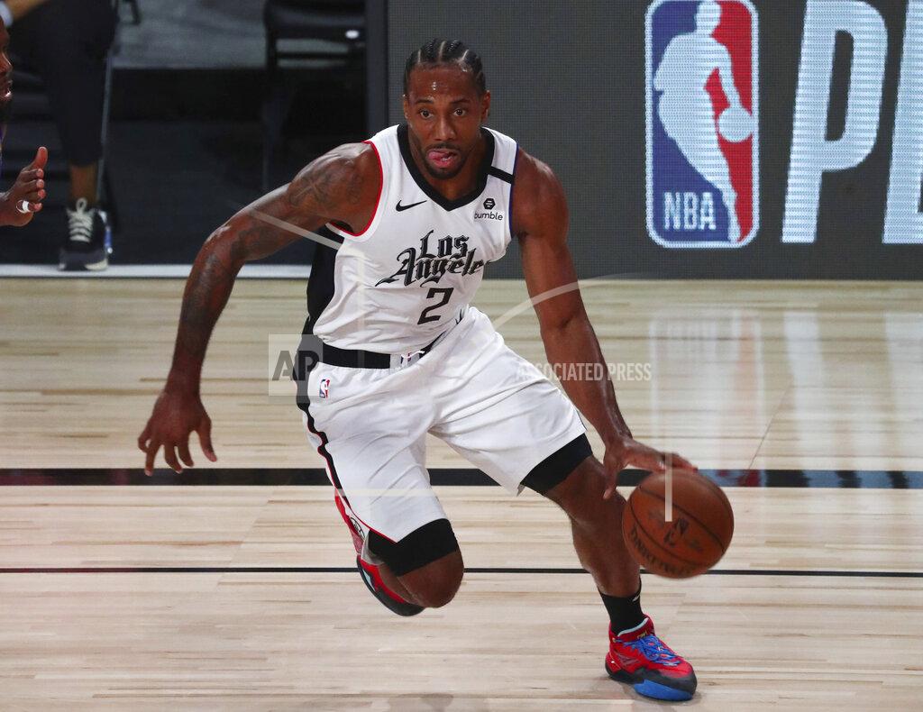 Kim Klement Los Angeles Clippers' forward Kawhi Leonard (2) controls the ball against the Denver Nuggets during the first half of an NBA basketball game Wednesday, Aug. 12, 2020, in Lake Buena Vista, Fla. (Kim Klement/Pool Photo via AP)