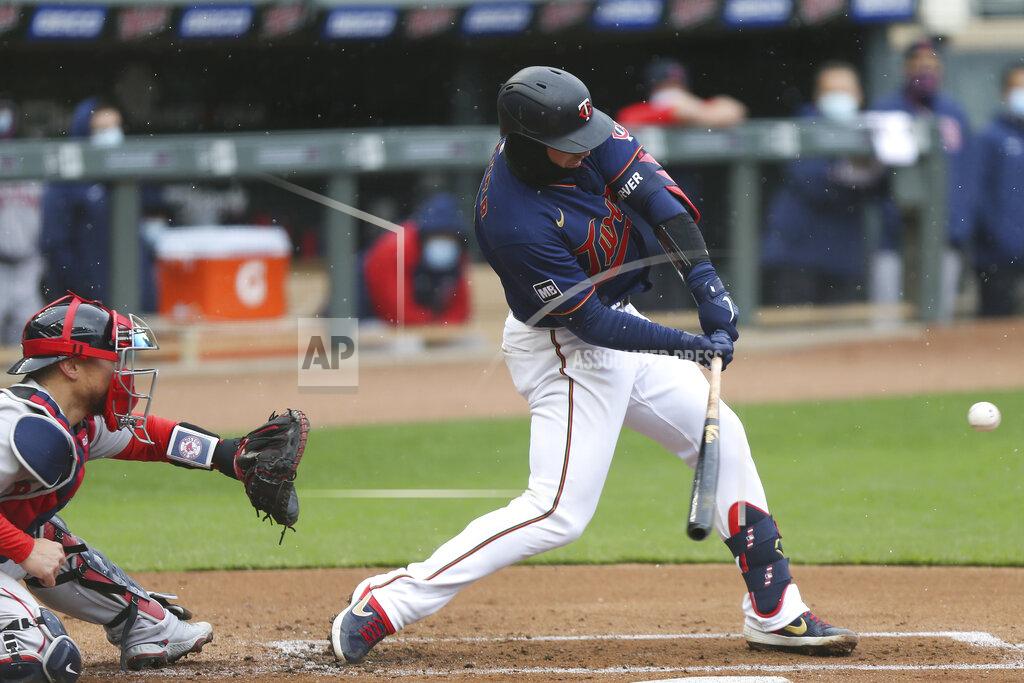 Stacy Bengs Minnesota Twins' Mitch Garver (8) swings at the ball during the first inning of a baseball game against the Boston Red Sox, Tuesday, April 13, 2021, in Minneapolis. (AP Photo/Stacy Bengs)