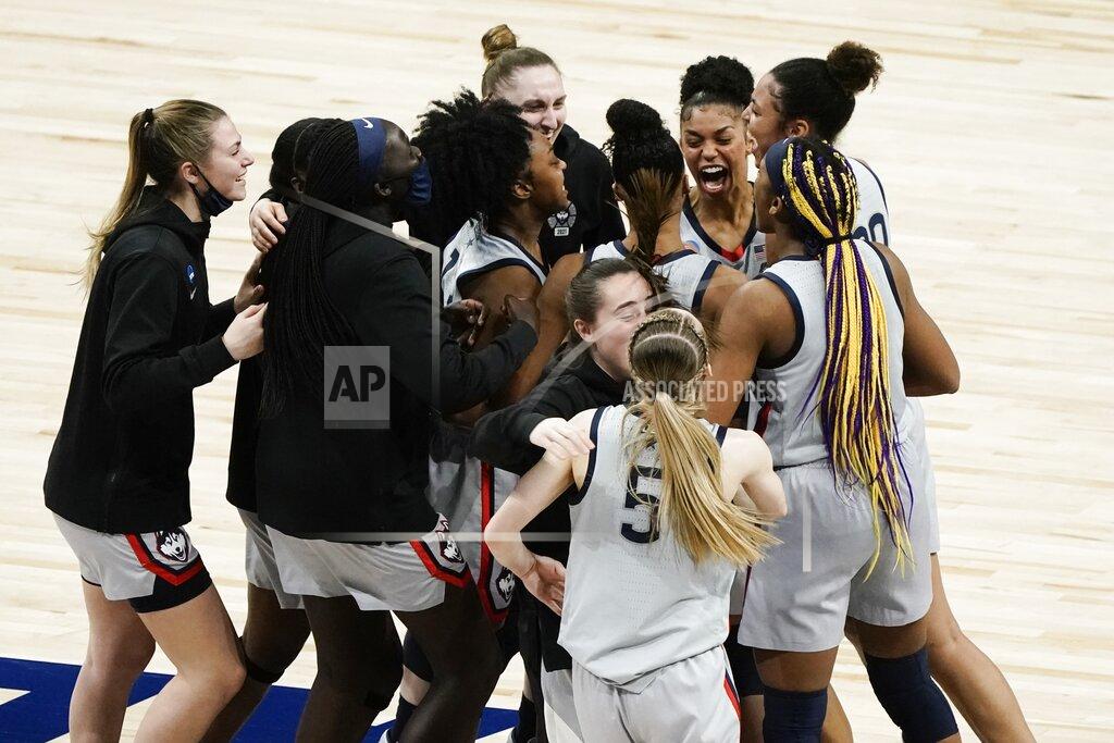 Morry Gash UConn players celebrate after an NCAA college basketball game against Baylor in the Elite Eight round of the Women's NCAA tournament Monday, March 29, 2021, at the Alamodome in San Antonio. UConn won 69-67 to advance to the Final Four. (AP Photo/Morry Gash)