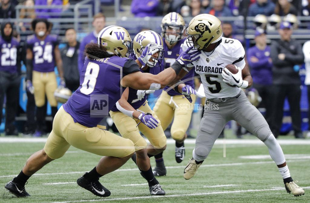 Ted S. Warren Colorado wide receiver Dimitri Stanley, right, tries to get past Washington linebacker Benning Potoa'e, left, during the first half of an NCAA college football game, Saturday, Oct. 20, 2018, in Seattle. (AP Photo/Ted S. Warren)