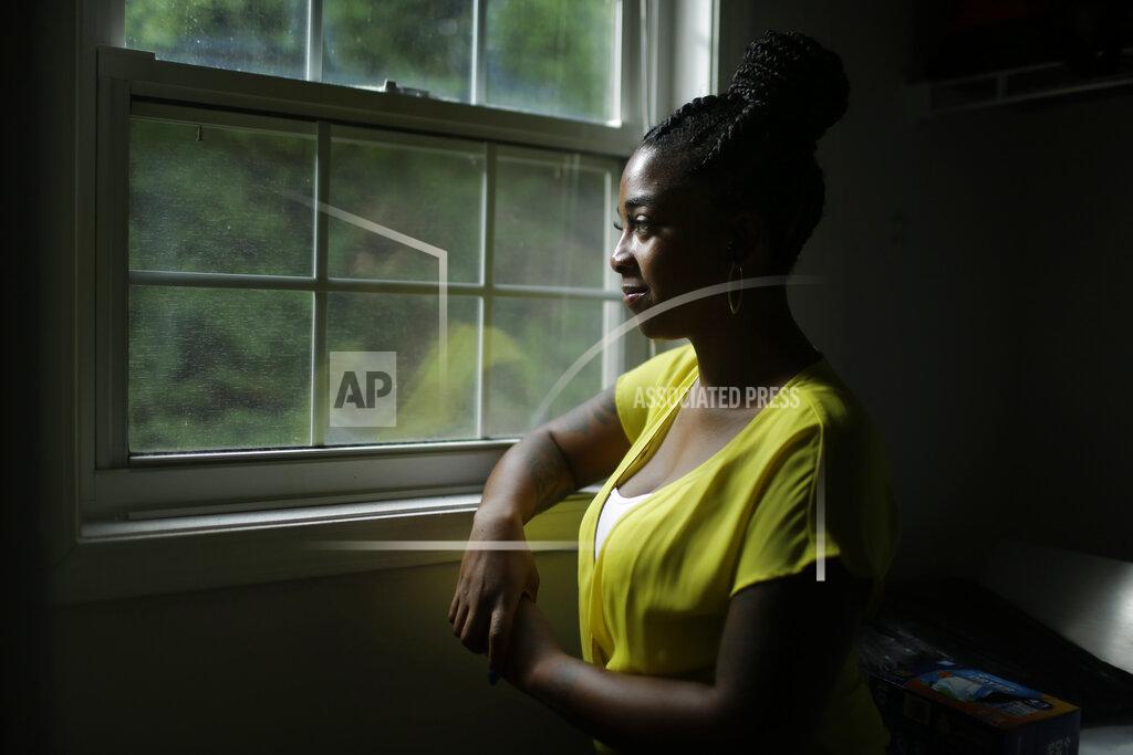 Brynn Anderson DeAnna Harris, first Black person to be elected to chair for the Cobb County Young Republicans poses for a portrait on Thursday, July 9, 2020, in Mableton, Ga. When Harris was recently elected chair of the Cobb County Young Republicans, the first Black person in the post, she held her inaugural event at the historic African American church she attends to highlight the community's Black Republicans: the district attorney, deputy sheriff, a former state representative. The crowd was diverse, she said, and she was proud of that. (AP Photo/Brynn Anderson)