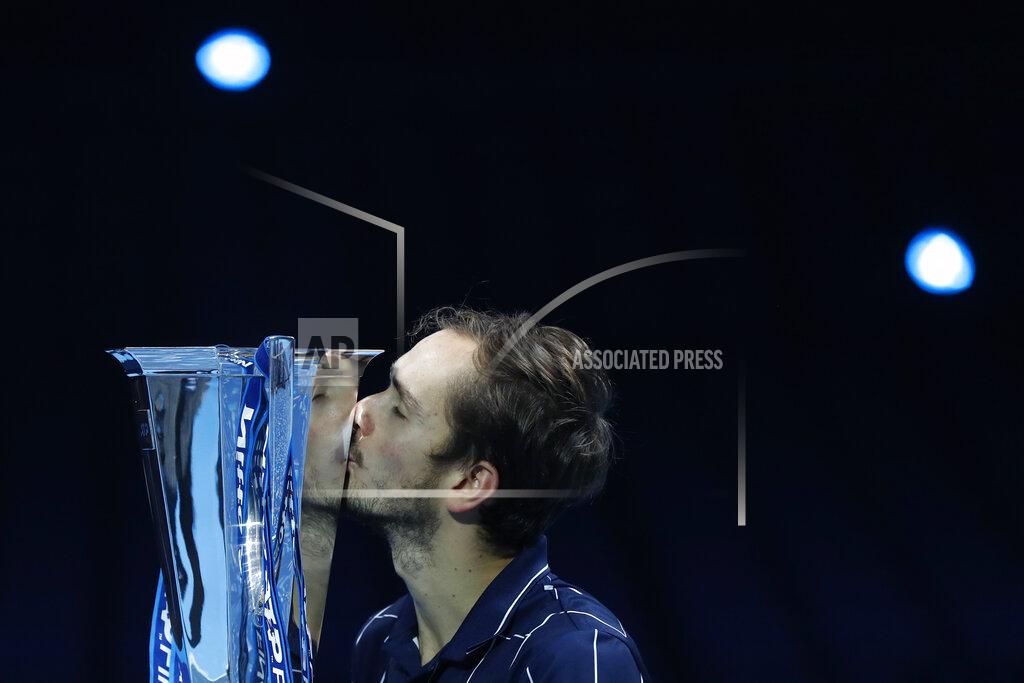 Frank Augstein Daniil Medvedev of Russia kisses the winners trophy after defeating Dominic Thiem of Austria in the final of the ATP World Finals tennis match at the ATP World Finals tennis tournament at the O2 arena in London, Sunday, Nov. 22, 2020. (AP Photo/Frank Augstein)