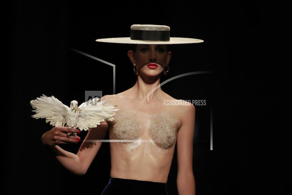 Lewis Joly EDS NOTE: NUDITY - A model wears a creation for Schiaparelli's Haute Couture Fall/Winter 2022-2023 fashion collection, Monday, July 4, 2022 in Paris. (AP Photo/Lewis Joly)