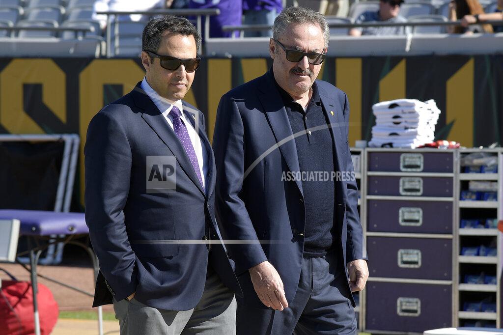 Phelan M. Ebenhack FILE - In this Dec. 11, 2016, file photo, Minnesota Vikings owners Mark Wilf, left, and Zygi Wilf watch warmups from the sideline before an NFL football game against the Jacksonville Jaguars in Jacksonville, Fla. The owners of the Minnesota Vikings have finalized the acquisition of Orlando City, giving the Wilf family control of the MLS franchise. (AP Photo/Phelan M. Ebenhack, File)