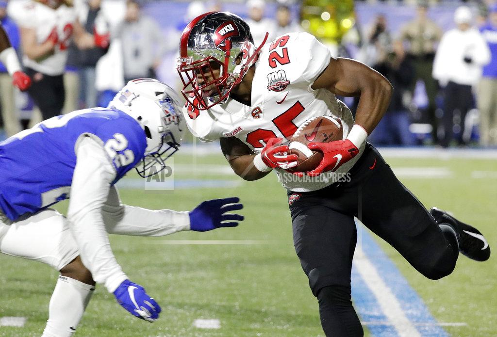 Mark Humphrey Western Kentucky running back Joshua Samuel (25) carries the ball as Middle Tennessee defensive back Cordell Hudson (22) closes in during the first half of an NCAA college football game Friday, Nov. 2, 2018, in Murfreesboro, Tenn. (AP Photo/Mark Humphrey)