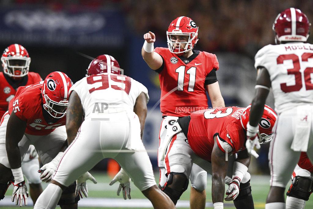 Aj Reynolds Georgia quarterback Jake Fromm (11) points during an NCAA college football game against Alabama for the Southeastern Conference championship Saturday, Dec. 1, 2018, in Atlanta. (AJ Reynolds/Athens Banner-Herald via AP)
