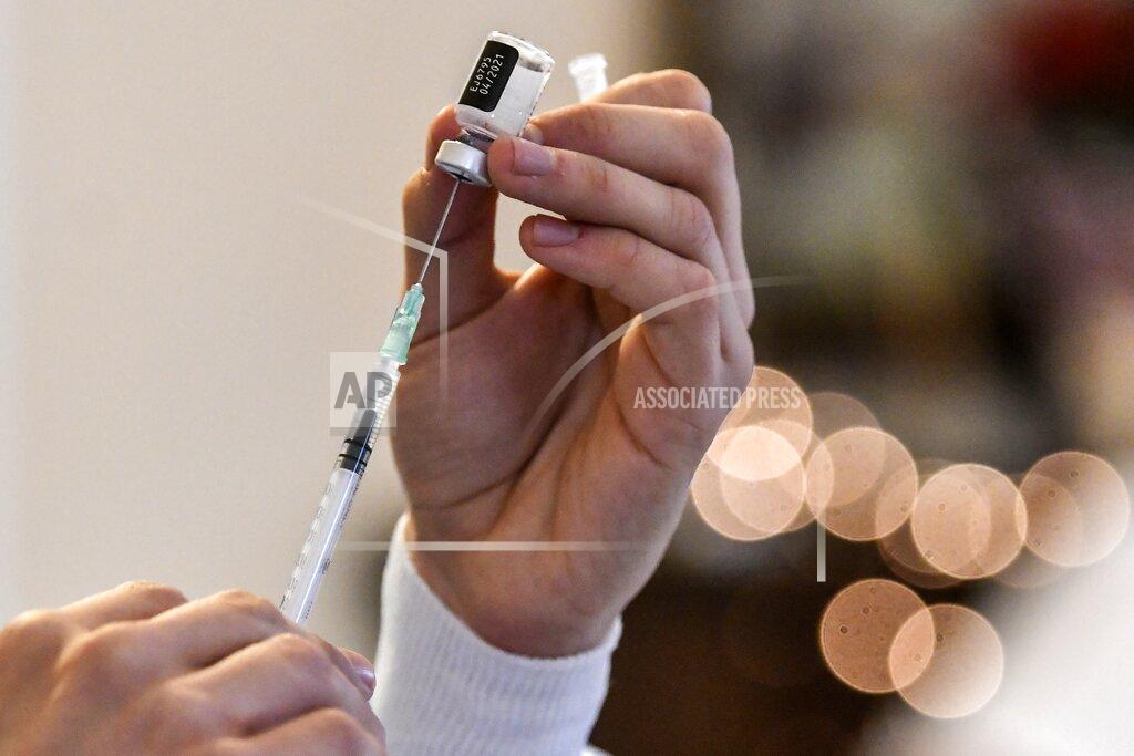 Lousia Gouliamaki A nurse prepares a vaccine prior to the vaccination of elderly people at a nursing house in Athens, Monday, Jan. 4, 2021. Vaccinations were expanded from 9 to 50 hospitals nationwide on Monday. (Louisa Gouliamaki/Pool via AP)