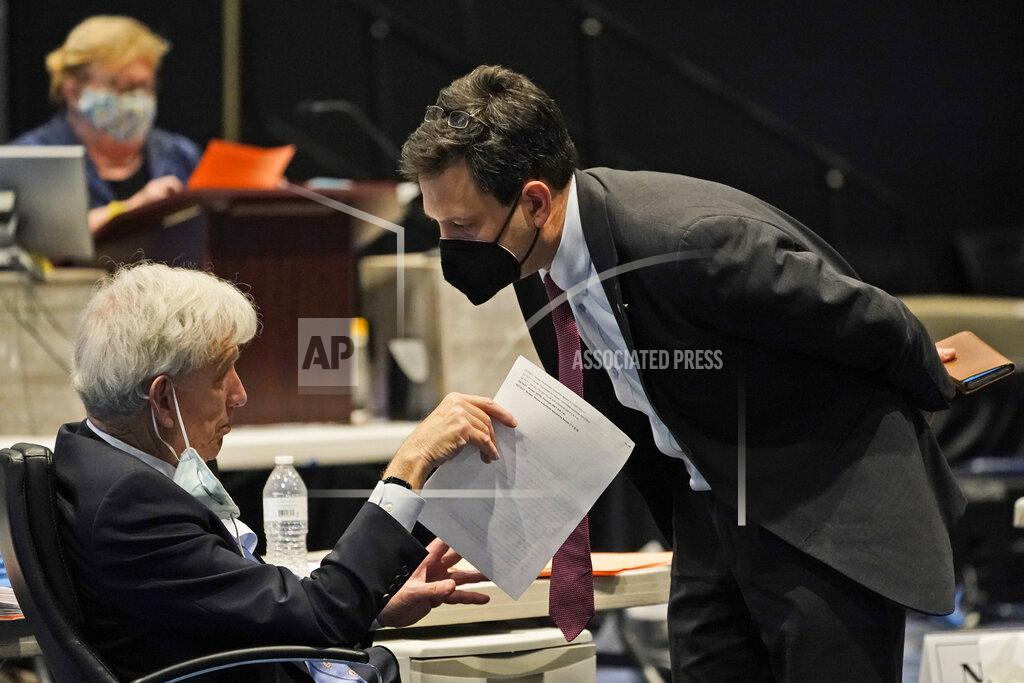 Steve Helber Virginia Senate majority leader Richard Saslaw, left, D-Fairfax, talks with Sen. Scott Surovell, D-Fairfax, during the Senate session at the Science Museum in Richmond, Va., Thursday, Feb. 18, 2021. (AP Photo/Steve Helber)