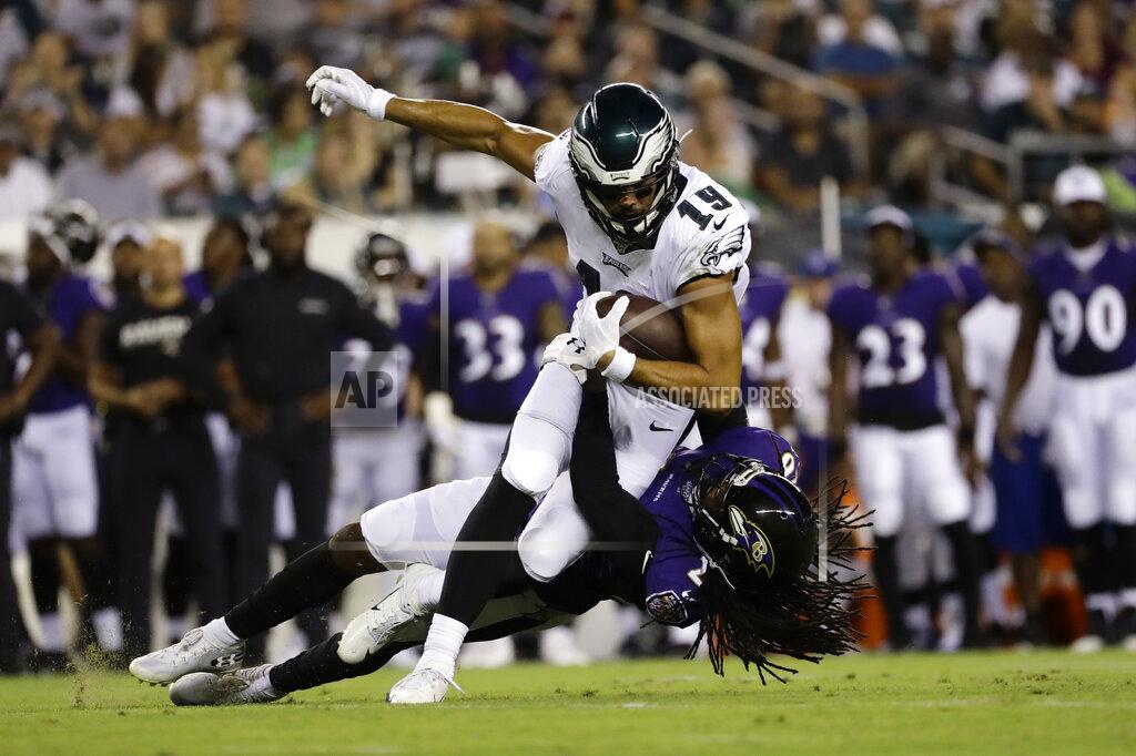 Michael Perez Philadelphia Eagles' JJ Arcega-Whiteside (19) is tackled by Baltimore Ravens' Maurice Canady (26) during the first half of a preseason NFL football game Thursday, Aug. 22, 2019, in Philadelphia. (AP Photo/Michael Perez)