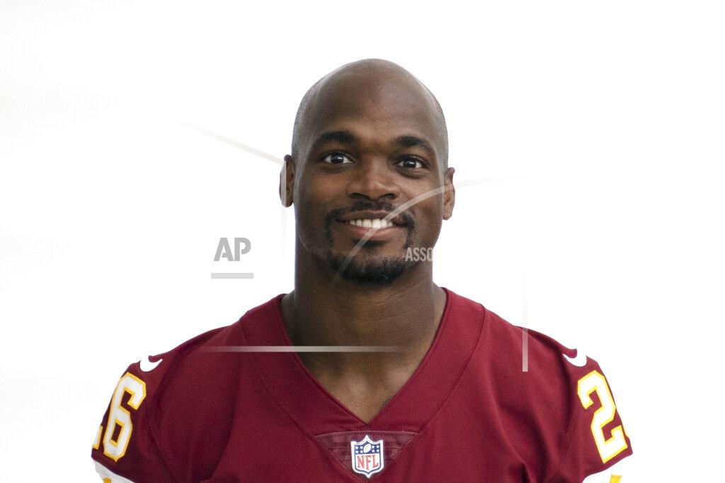 FILE - This is a 2020 file photo showing Adrian Peterson of the Washington NFL football team. Washington released veteran running back Adrian Peterson on Friday, Sept. 4, 2020, a stunning move by first-year coach Ron Rivera in the name of getting younger. Rivera called Peterson early in the morning asking him to come to the practice facility, then delivered the news the team was moving on from the 35-year-old star. The move came less than 36 hours before NFL rosters must be trimmed to the 53-man limit and nine days before the start of the regular season. (AP Photo/File)