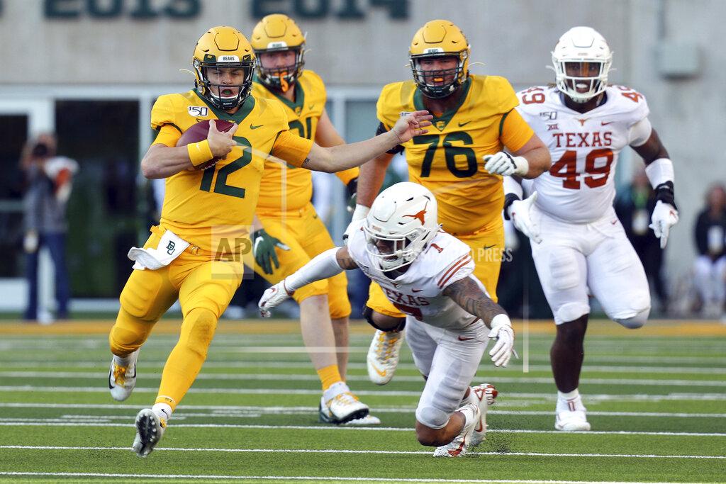 Richard W. Rodriguez Baylor quarterback Charlie Brewer (12) runs the ball against Texas in the third quarter in an NCAA college football game Saturday, Nov. 23, 2019, in Waco, Texas. (AP Photo/Richard W. Rodriguez)