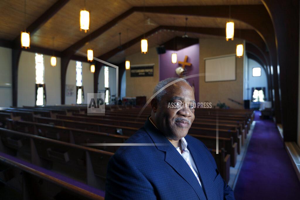 Charles Rex Arbogast Pastor Hurley J. Coleman Jr., poses for a portrait Monday, June 29, 2020, inside the sanctuary of the World Outreach Campus Church in Saginaw, Mich. He says recent protests were the first time he's seen Blacks and whites march together in Saginaw favor of racial equality. “This is one of those terrible growth moments where people of goodwill and good thought can bring us to another level. ... When you build on truth, anything is possible.” (AP Photo/Charles Rex Arbogast)