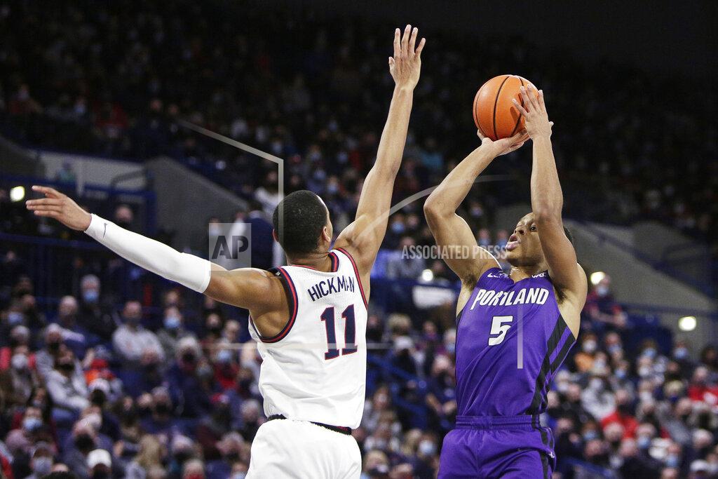 Young Kwak Portland guard Chris Austin (5) shoots over Gonzaga guard Nolan Hickman (11) during the first half of an NCAA college basketball game, Saturday, Jan. 29, 2022, in Spokane, Wash. (AP Photo/Young Kwak)