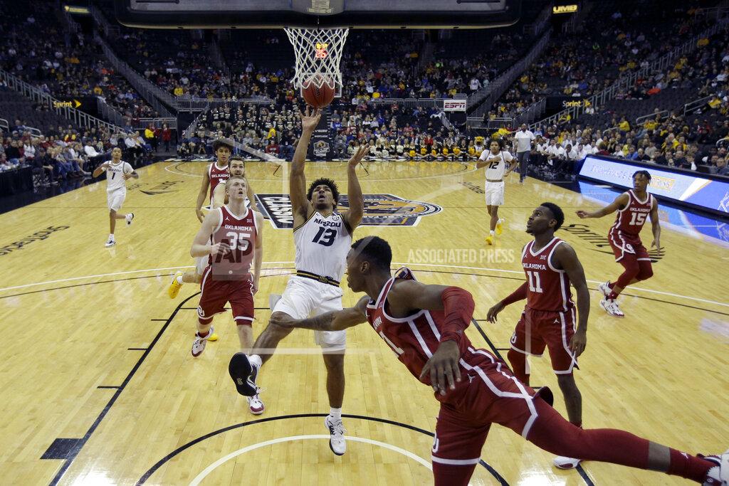 Charlie Riedel Missouri guard Mark Smith (13) shoots during the first half of an NCAA college basketball game against Oklahoma, Tuesday, Nov. 26, 2019, in Kansas City, Mo. (AP Photo/Charlie Riedel)