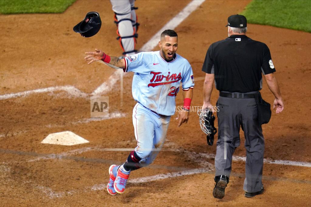 Jim Mone Minnesota Twins' Eddie Rosario tosses his helmet as he scores the winning run on a Max Kepler hit off Detroit Tigers' Bryan Garcia during the 10th inning of a baseball game Tuesday, Sept. 22, 2020, in Minneapolis. The Twins won 5-4. (AP Photo/Jim Mone)