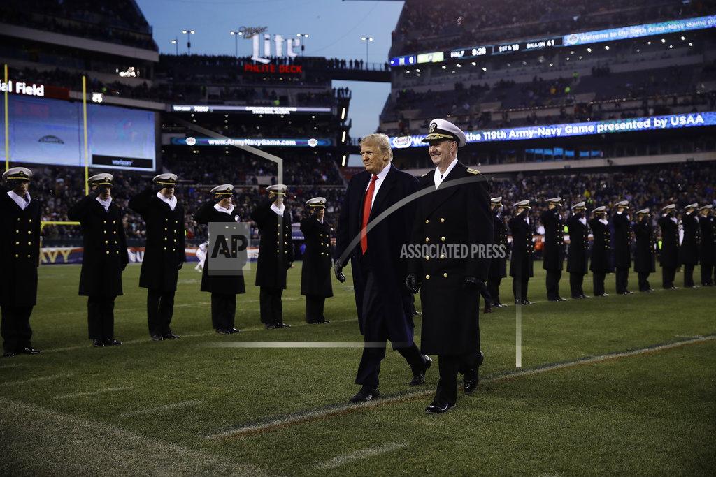 Matt Rourke President Donald Trump, left, walks with Naval Academy Superintendent Vice Adm. Ted Carter, right, across the field after the first half of an NCAA college football game between the Army and the Navy, Saturday, Dec. 8, 2018, in Philadelphia. (AP Photo/Matt Rourke)