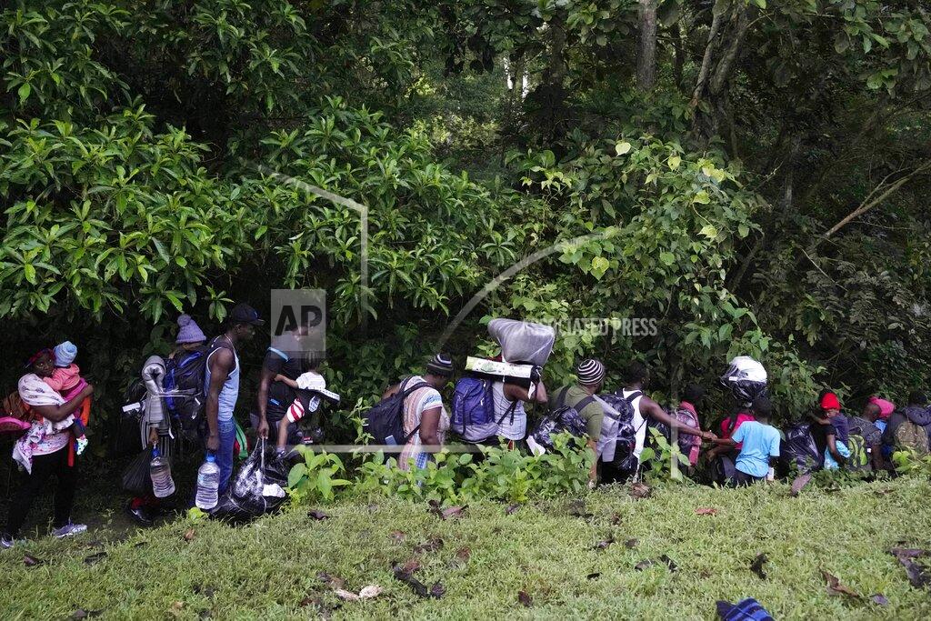 Fernando Vergara Migrants continue their trek north, near Acandi, Colombia, Wednesday, Sept. 15, 2021. The migrants, mostly Haitians, are on their way to crossing the Darien Gap from Colombia into Panama dreaming of reaching the U.S. (AP Photo/Fernando Vergara)