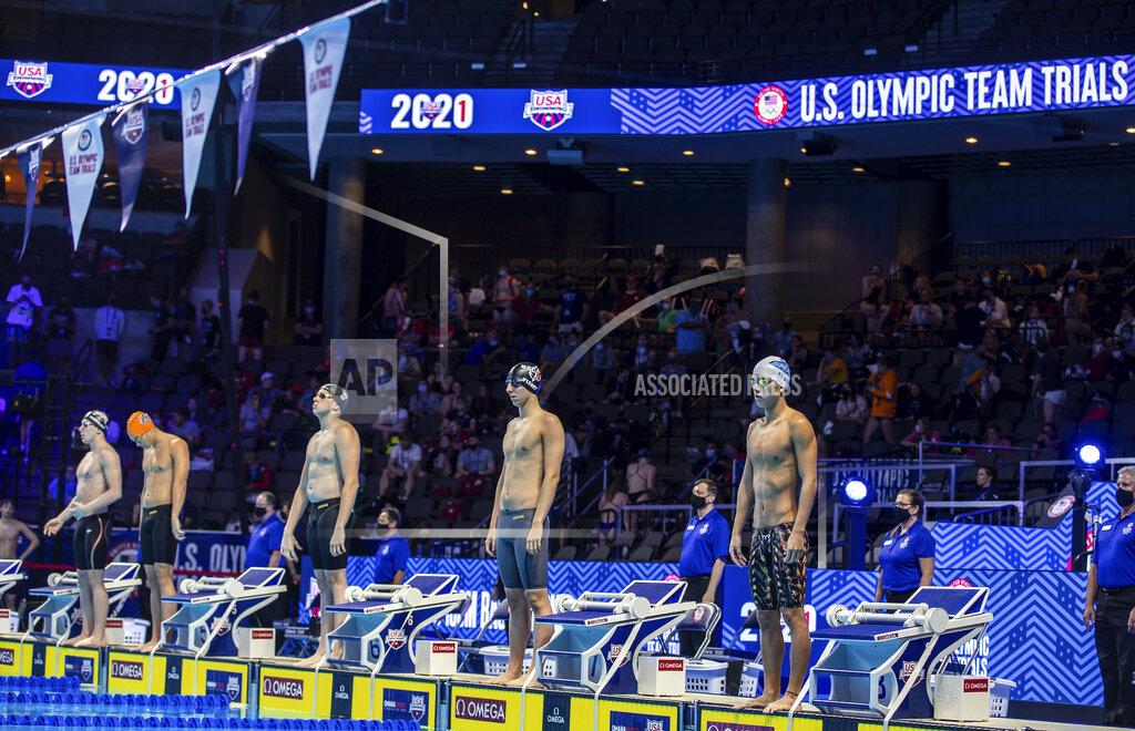 Swimmers line up to competes in the 100-meter backstroke during wave 1 of the U.S. Olympic Swim Trials on Friday, June 4, 2021, in Omaha, Neb. (Chris Machian/Omaha World-Herald via AP)