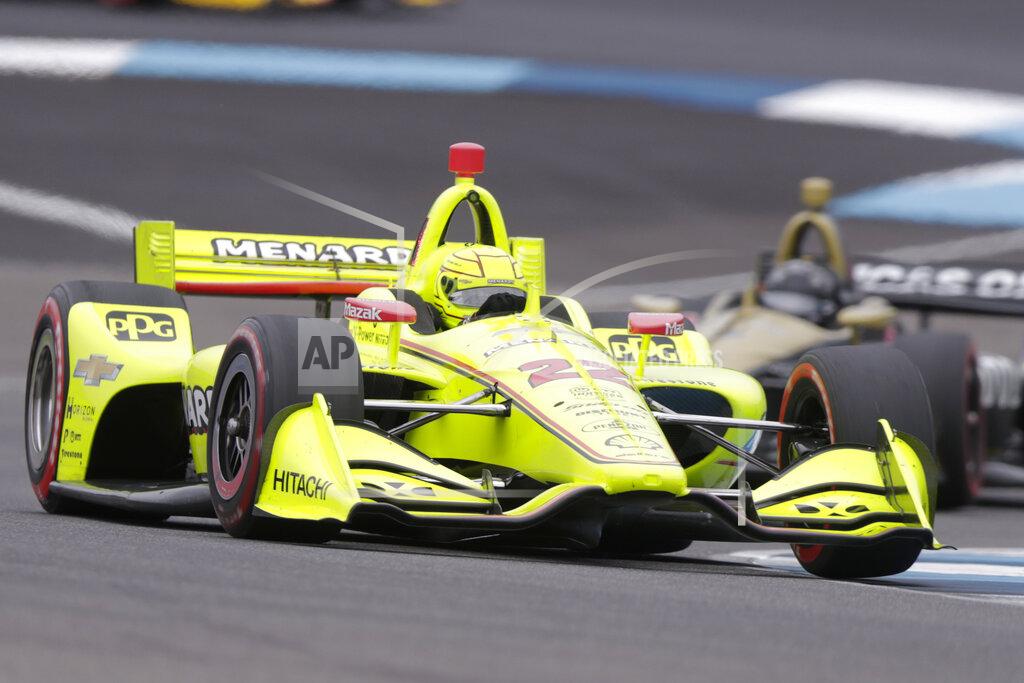 Michael Conroy Simon Pagenaud, of France, drives through a turn on his way to winning the Indy GP IndyCar auto race at Indianapolis Motor Speedway, Saturday, May 11, 2019, in Indianapolis. (AP Photo/Michael Conroy)