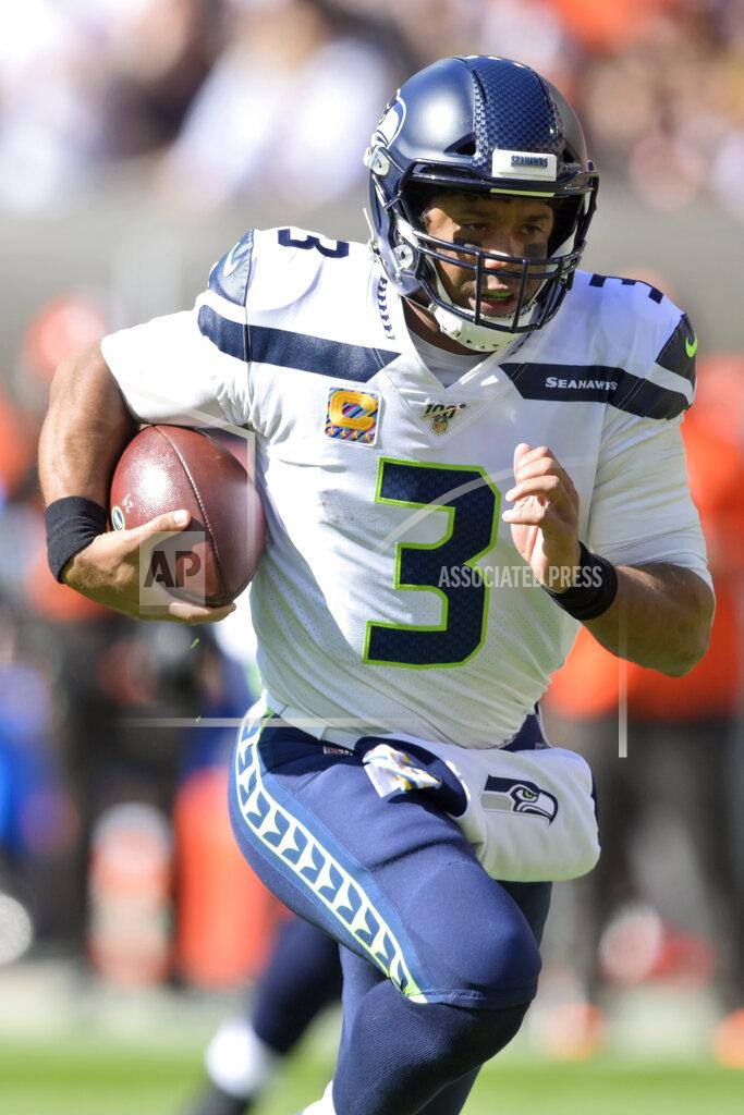 David Richard Seattle Seahawks quarterback Russell Wilson rushes for a 16-yard touchdown during the first half of an NFL football game against the Cleveland Browns, Sunday, Oct. 13, 2019, in Cleveland. (AP Photo/David Richard)