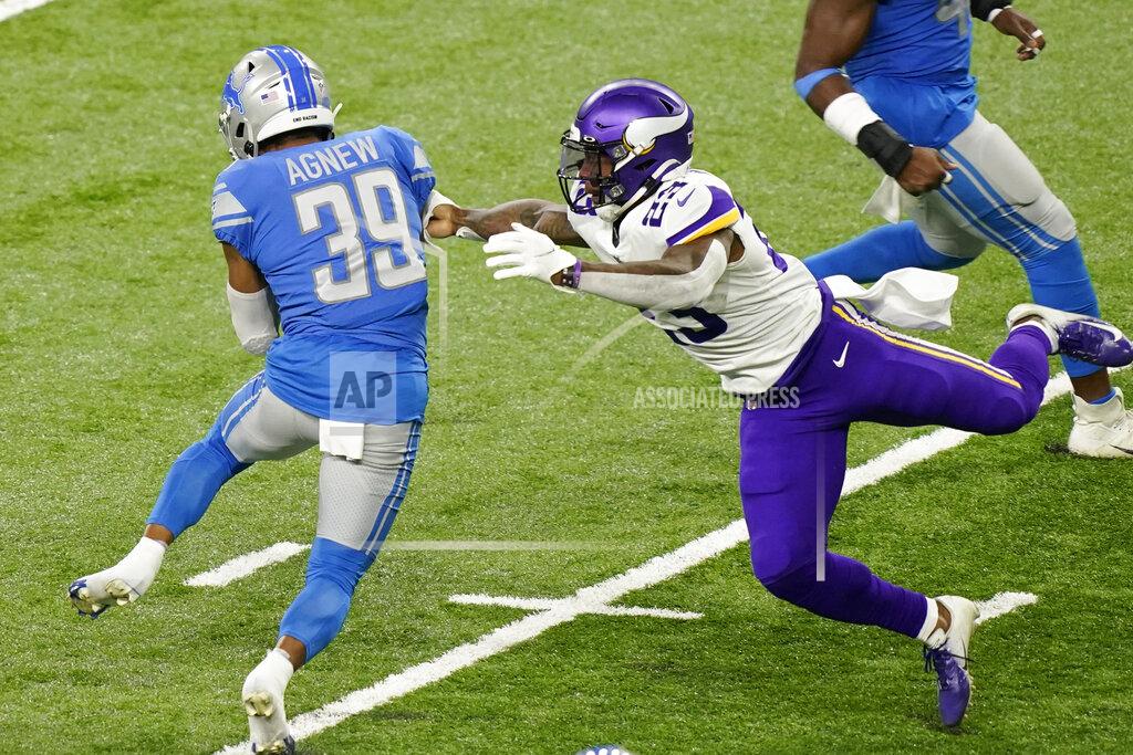 Carlos Osorio Minnesota Vikings' Mike Boone (23) tackles Detroit Lions' Jamal Agnew (39) on a punt return during the first half of an NFL football game, Sunday, Jan. 3, 2021, in Detroit. (AP Photo/Carlos Osorio)