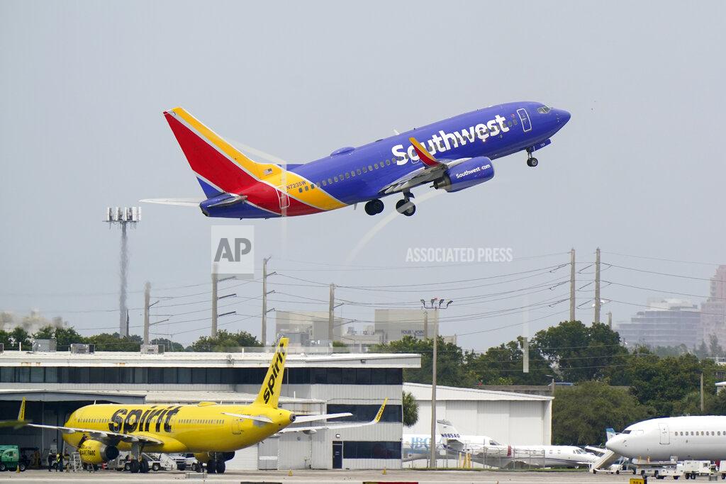 A Southwest Airlines Boeing 737-7H4 takes off, Tuesday, Oct. 20, 2020, from Fort Lauderdale-Hollywood International Airport in Fort Lauderdale, Fla. Airlines are continuing to pile up billions of dollars in losses as the pandemic causes a massive drop in air travel. Southwest Airlines on Thursday, Oct. 22, lost $1.16 billion in the normally strong third quarter, which includes most of the summer vacation season.(AP Photo/Wilfredo Lee)