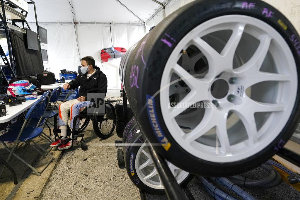 John Raoux Robert Wickens in his pit stall, prepares to go out on the track during practice for the Rolex 24 hour auto race at Daytona International Speedway, Thursday, Jan. 27, 2022, in Daytona Beach, Fla. (AP Photo/John Raoux)