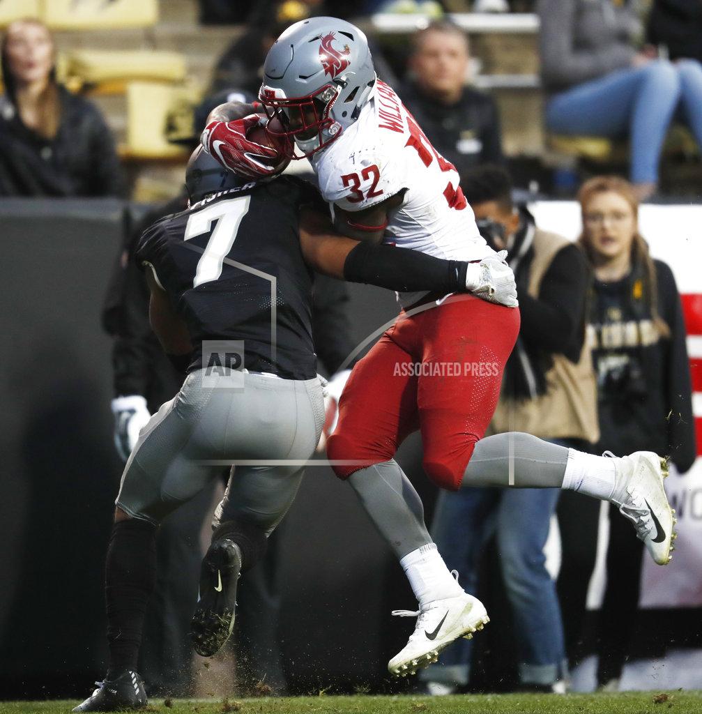 David Zalubowski Colorado defensive back Nick Fisher, left, tackles Washington State running back James Williams after a short gain in the second half of an NCAA college football game Saturday, Nov. 10, 2018, in Boulder, Colo. Washington State won 31-7. (AP Photo/David Zalubowski)