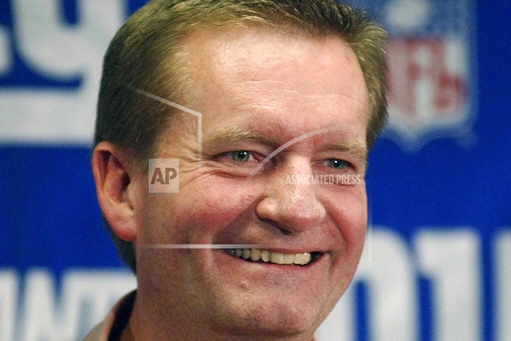 Bill Kostroun FILE - New York Giants coach Jim Fassel smiles as he talks to reporters at Giants Stadium in East Rutherford, N.J., in this Monday, Dec. 30, 2002, file photo. Fassel, a former coach of the New York Giants who was named NFL coach of the year in 1997 and led the team to the 2001 Super Bowl, has died. He was 71. Fassel's son, John, confirmed the death to the Los Angeles Times on Monday, June 7, 2021. According to the Los Angeles Times, Fassel was taken to a hospital in Las Vegas with chest pains and died of a heart attack. (AP Photo/Bill Kostroun, File)