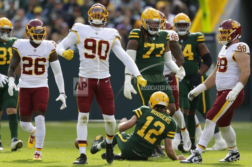 Matt Ludtke Washington Football Team's Montez Sweat celebrzates after sacking Green Bay Packers' Aaron Rodgers during the first half of an NFL football game Sunday, Oct. 24, 2021, in Green Bay, Wis. (AP Photo/Matt Ludtke)