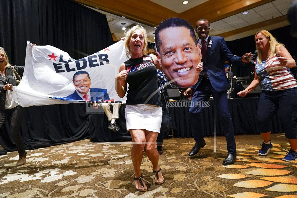 Ashley Landis Supporters of republican conservative radio show host Larry Elder gather as polls close for the California gubernatorial recall election Tuesday, Sept. 14, 2021, in Costa Mesa, Calif. The rare, late-summer election, which challenged California Governor Gavin Newsom, has emerged as a national battlefront on issues from COVID-19 restrictions to climate change. (AP Photo/Ashley Landis)