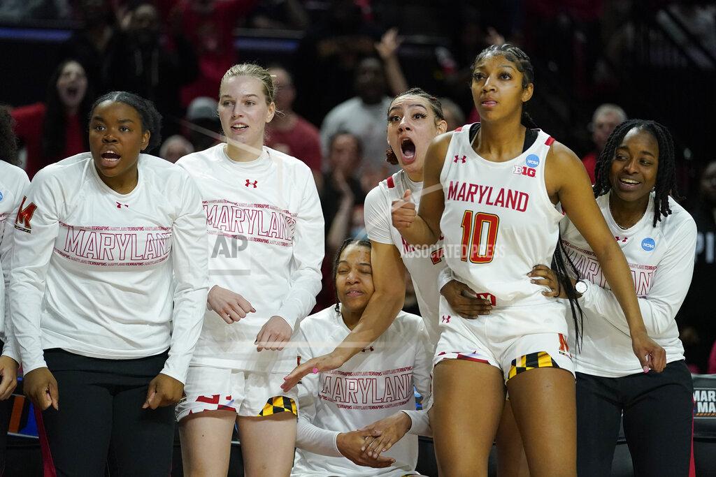 Julio Cortez The Maryland reacts after guard Diamond Miller, not visible, made a block on a shot by Florida Gulf Coast guard Tishara Morehouse during the first half of a college basketball game in the second round of the NCAA tournament, Sunday, March 20, 2022, in College Park, Md. (AP Photo/Julio Cortez)